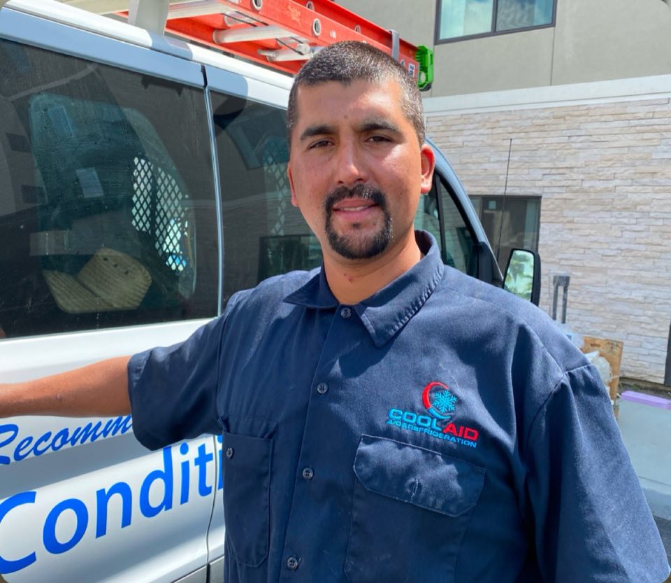 Cool Aid technician standing next to a company service van